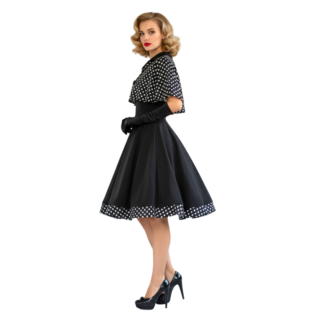 Woman wearing a black and white polka dot dress with a plain background